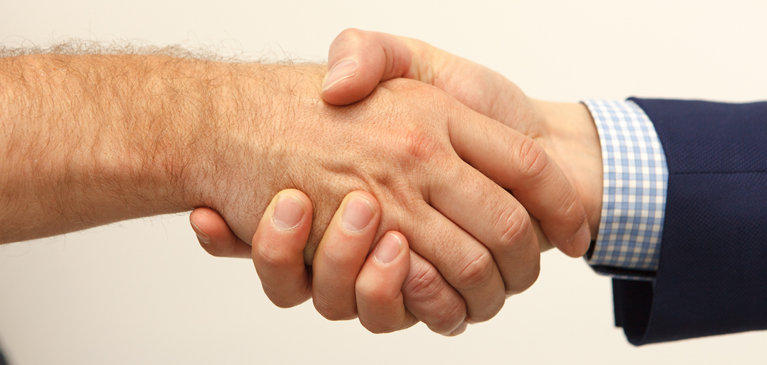 A close up of a handshake