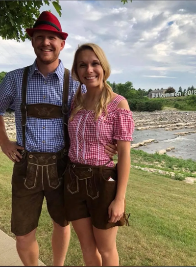 Madison and her husband dressed in German heritage attire