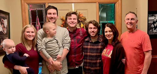 family posing for photo