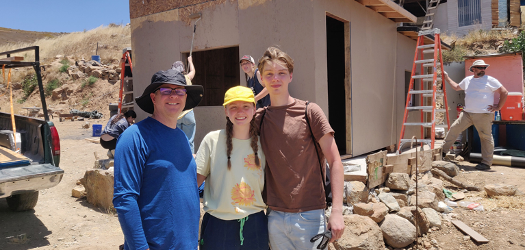 Three people standing together