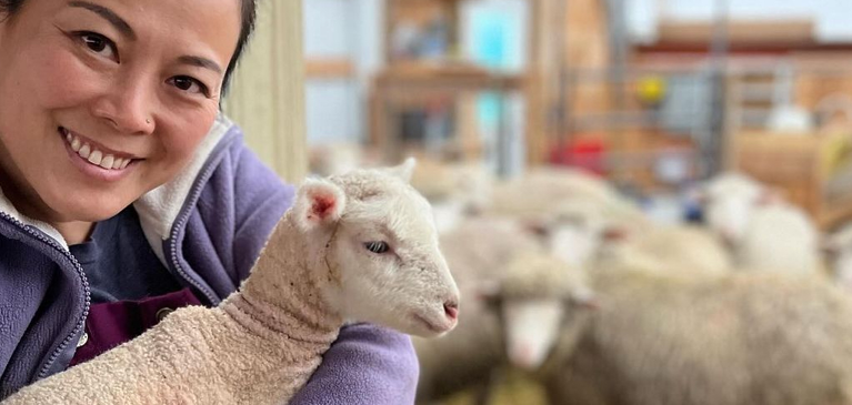 Dandan holding a lamb