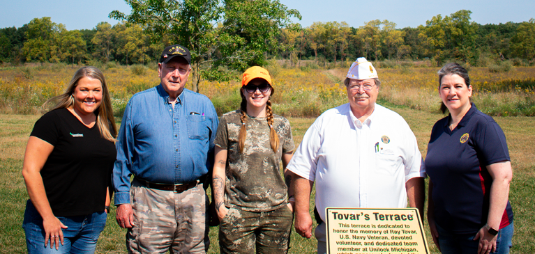 Volunteers of Camp Liberty stand with participants of a veteran hunt