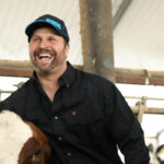 Member of Matsche Farms with cow