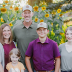 The Sullivan family in front of their sunflowers