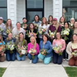 Floral design class holding their bouquets