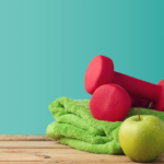 Water bottle with fitness equipment on blue background