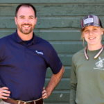 Heidi and Joel Arends pose in front of a barn