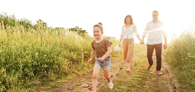 A family walking on their land
