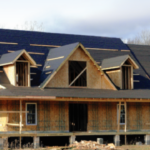 A two story house being built in the country on a clear sunny day with a GreenStone construction loan