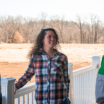 Three people standing and talking