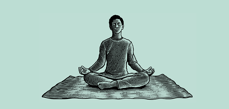 Man meditating on a rug