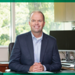 Travis Siting at His Desk