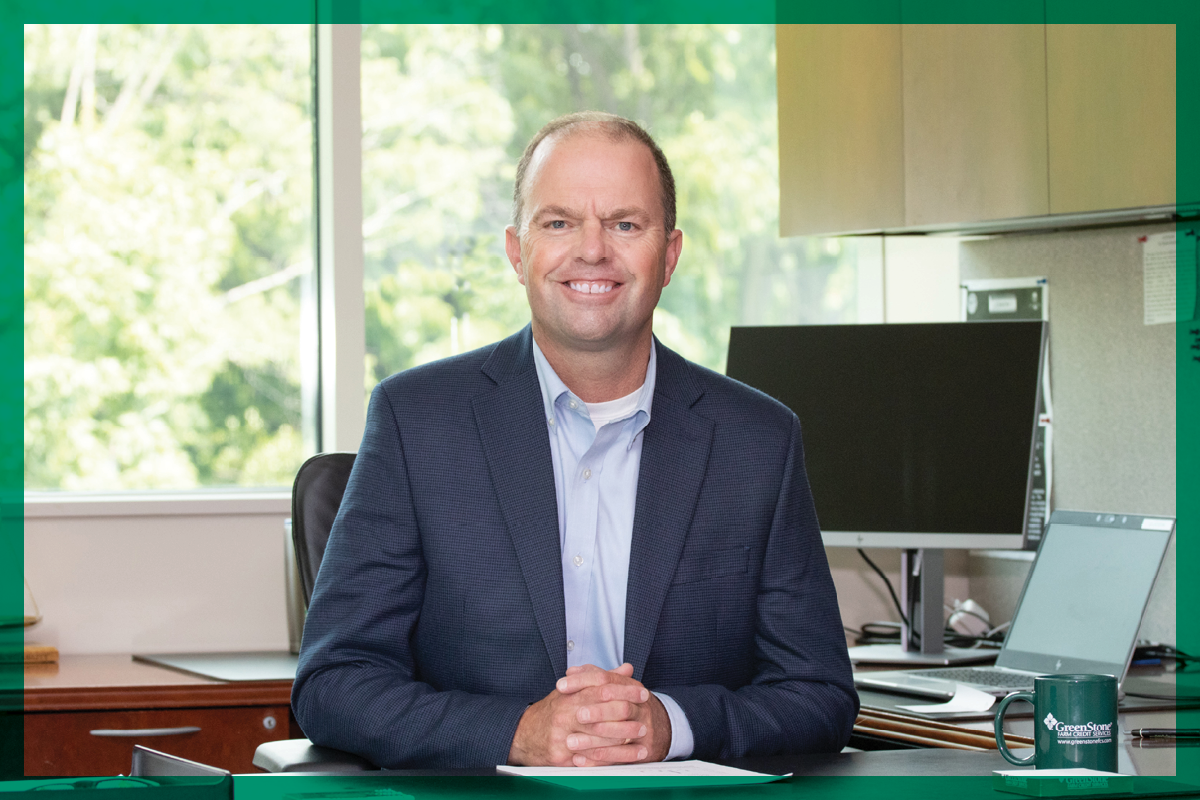 Travis Siting at His Desk