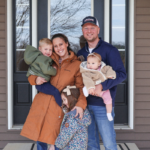 The Theilen family outside their new home