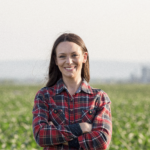 Woman farmer standing in field