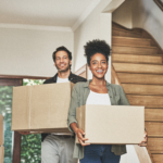 Couple with moving boxes in new home