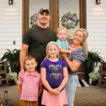 A family standing in front of their home